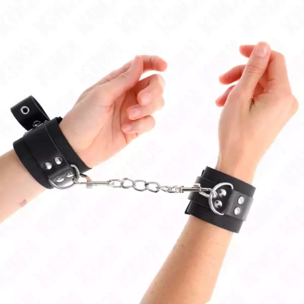 Kink – Appui-poignets en nylon noir avec ceinture en cuir noir ajustable 19-29 cm x 5,1 cm – BDSM & fétichisme
