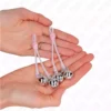 Kink – Pinces à télépin lumineuses crâne avec anneau cloches réglables rose / argent – vue 3 – BDSM & fétichisme
